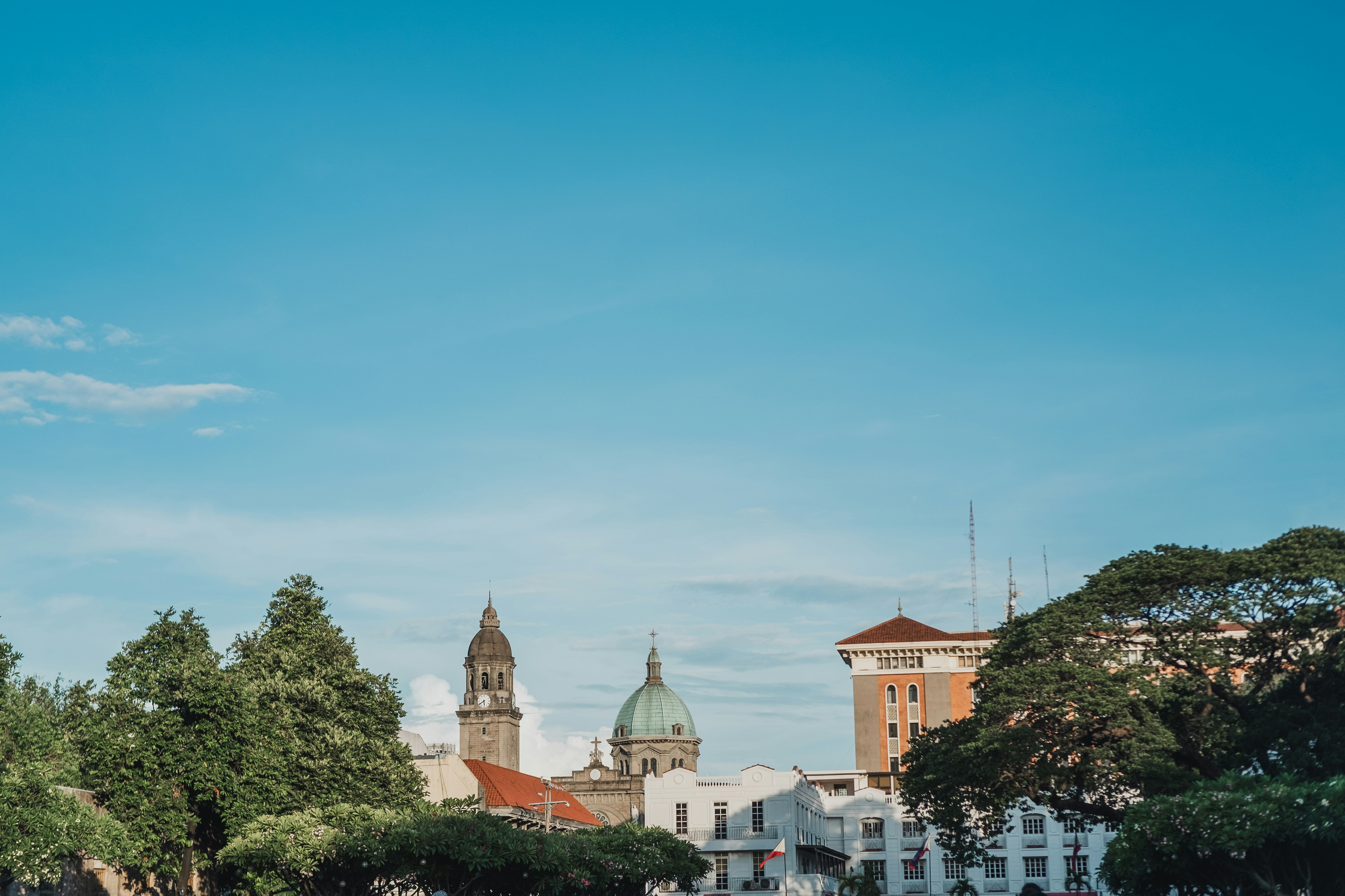 a large clock tower towering over a city