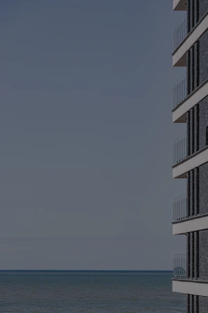 Modern condo building with balconies overlooking the sea in Trat province.