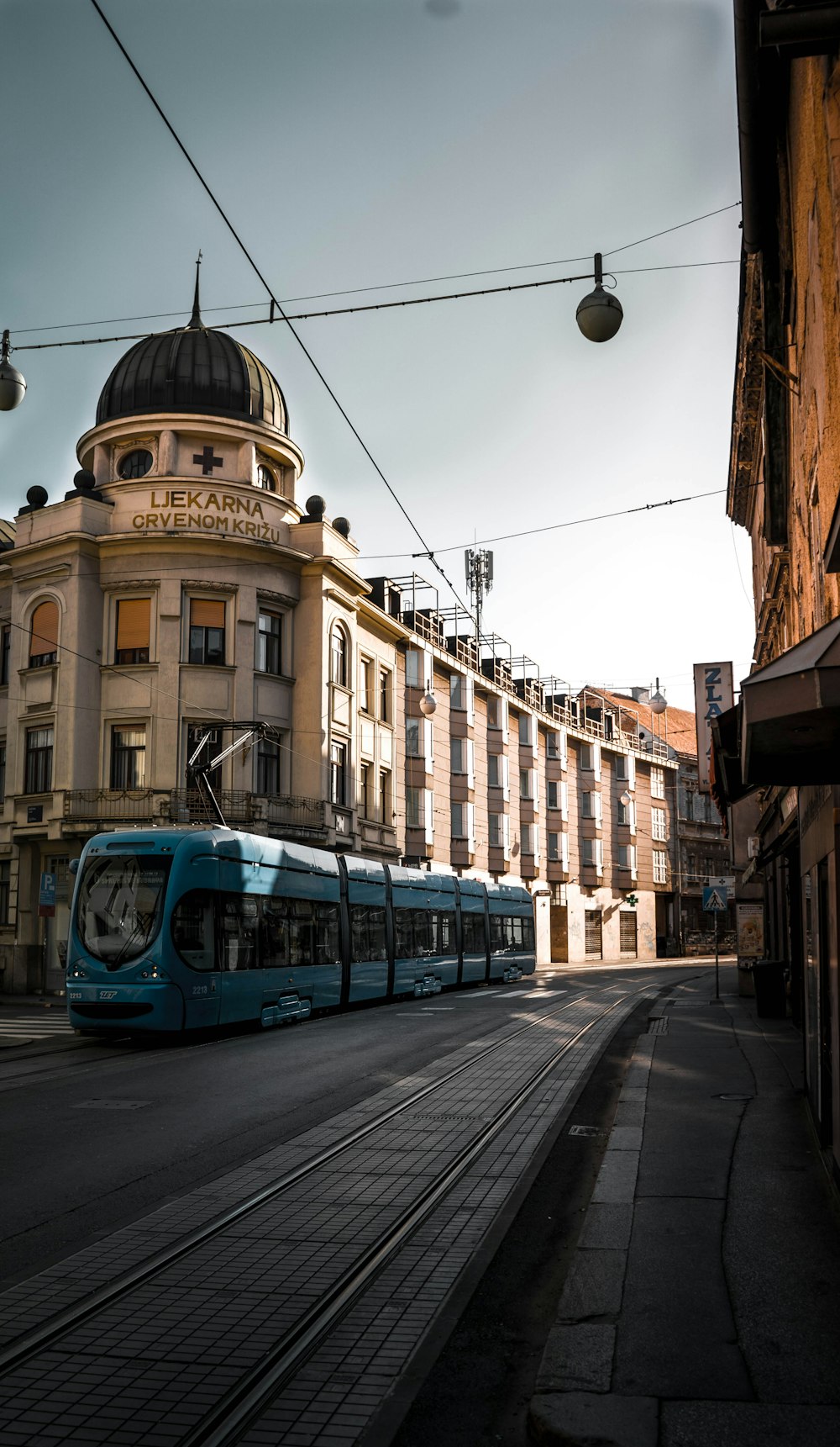 green train near building