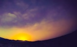 A vibrant sunset over the mountains in Himachal Pradesh.