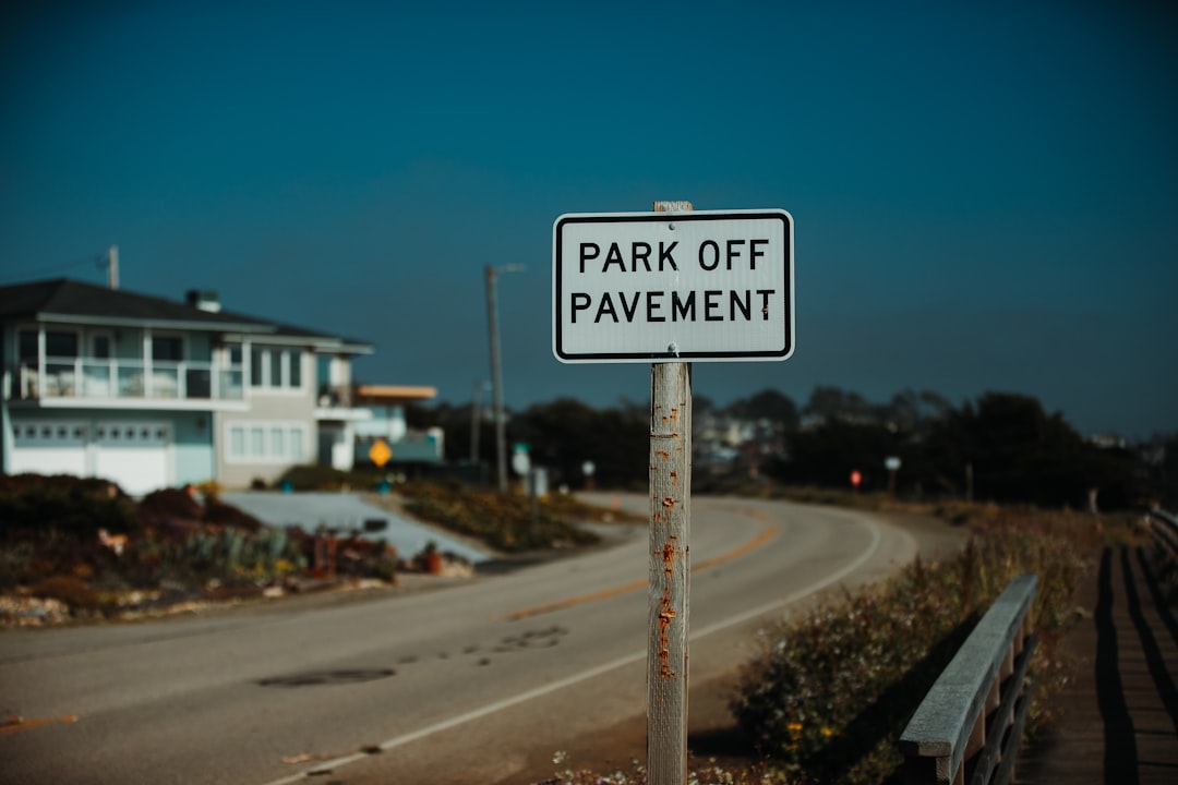 park off pavement signage on street