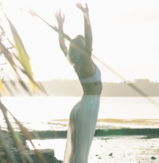 woman standing near body of water