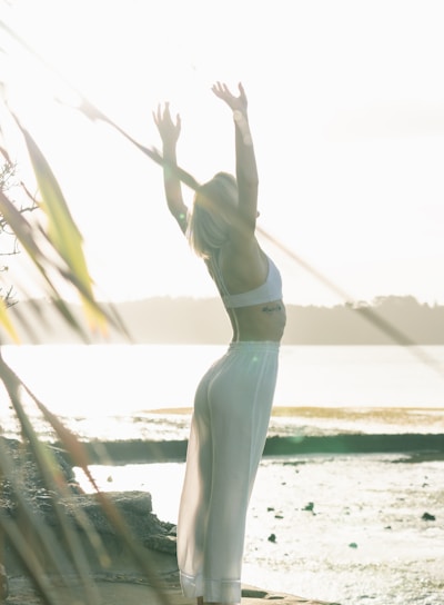 woman standing near body of water