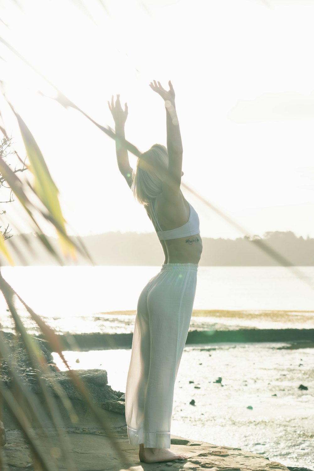 woman standing near body of water