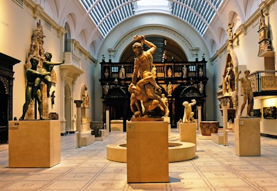 two naked man fighting each other statue