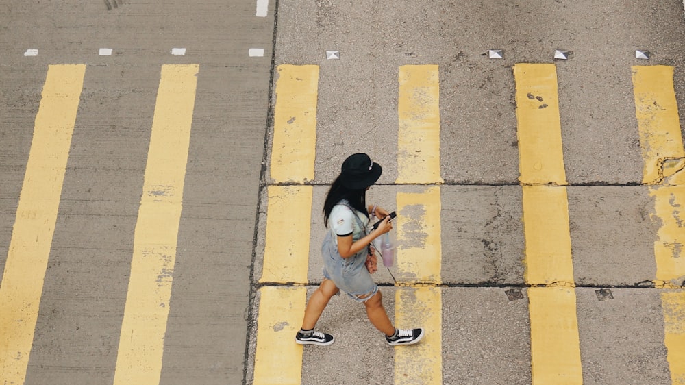 woman walking on pedestrian lane