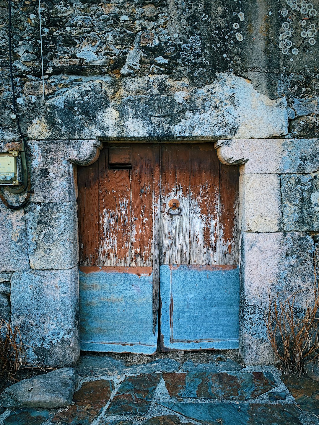 wooden doors in stone wall
