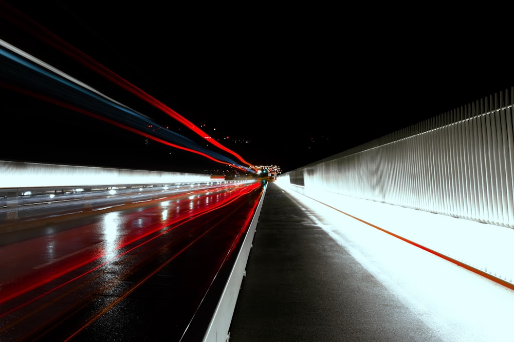 a long exposure photo of a street at night