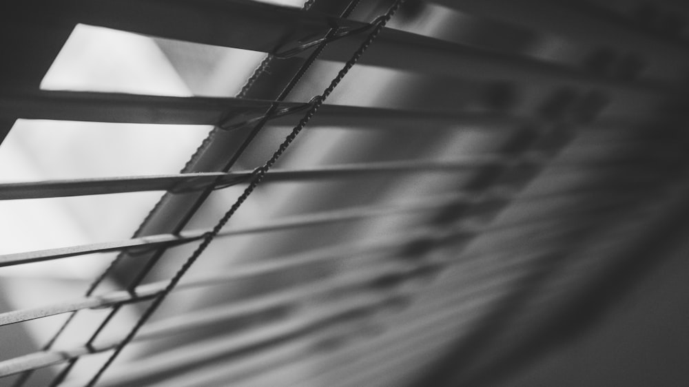 grayscale photography of window blinds