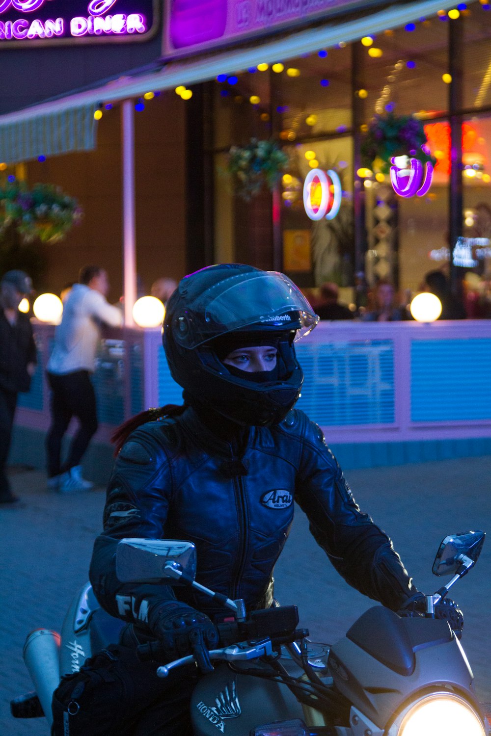 person riding gray Honda motorcycle