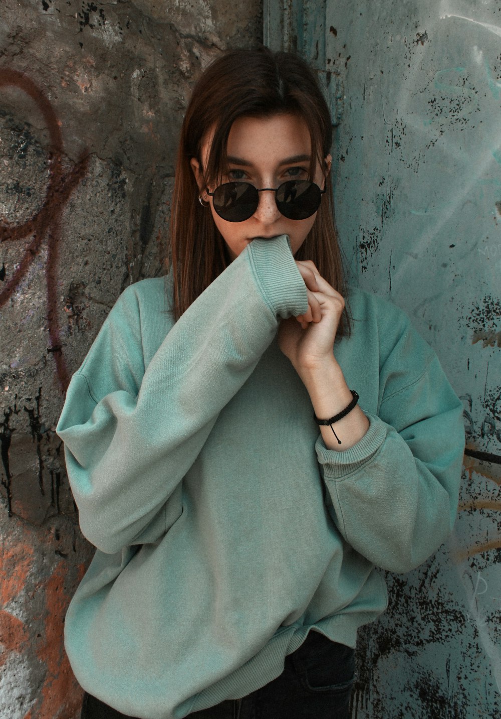 women's green sweatshirt close-up photography