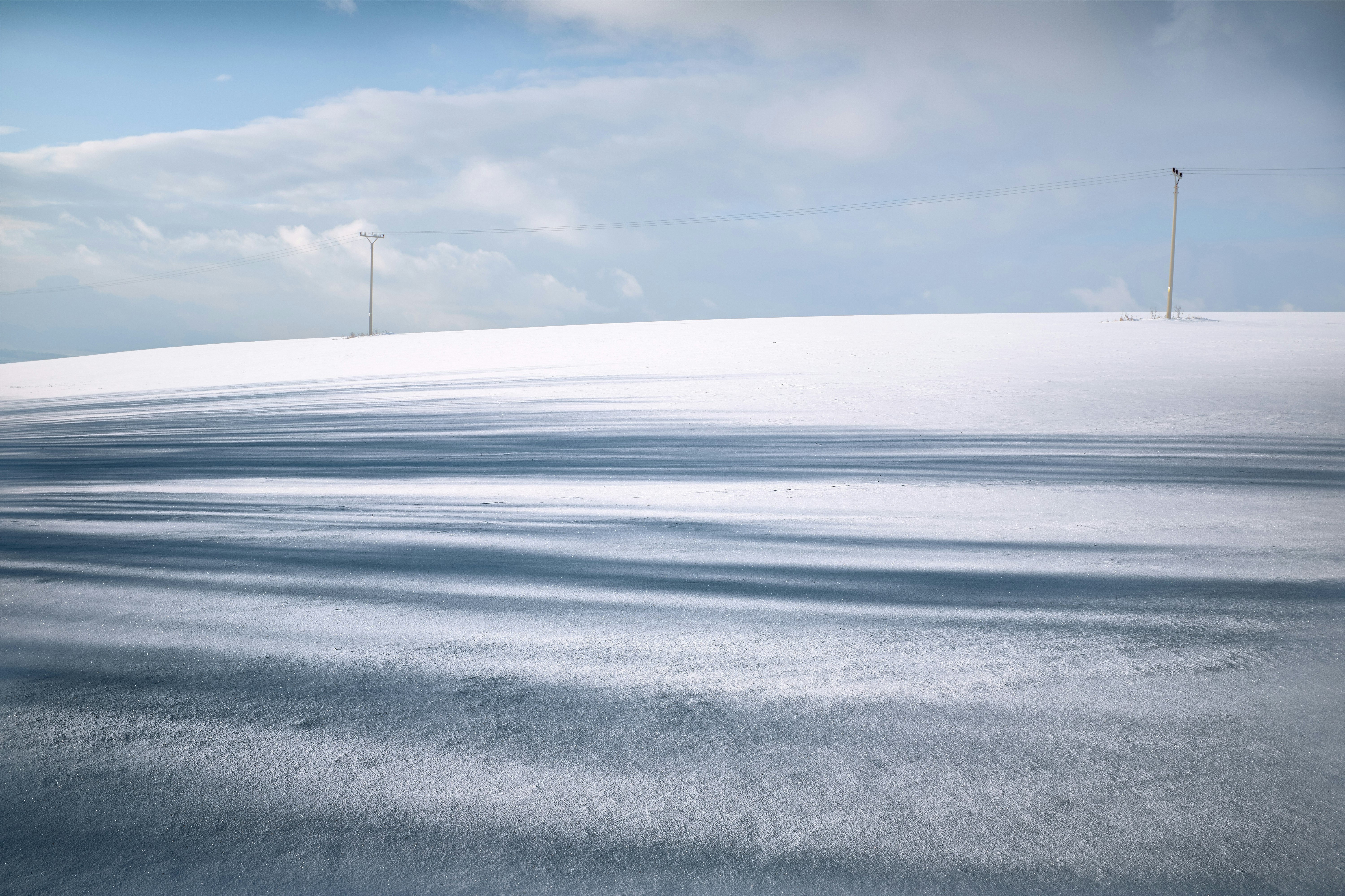 photography of snow-covered field during daytime