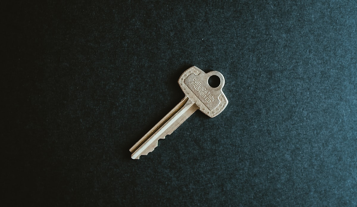 A house key on a flat surface representing home ownership and mortgage rates