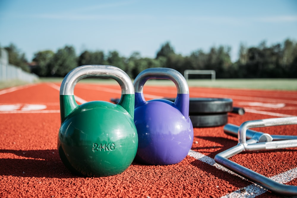 two green and purple kettlebells