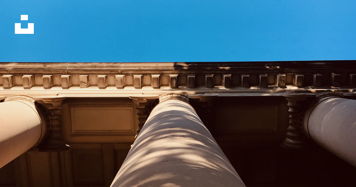 A view of the top of a building from below photo – Free Architecture ...