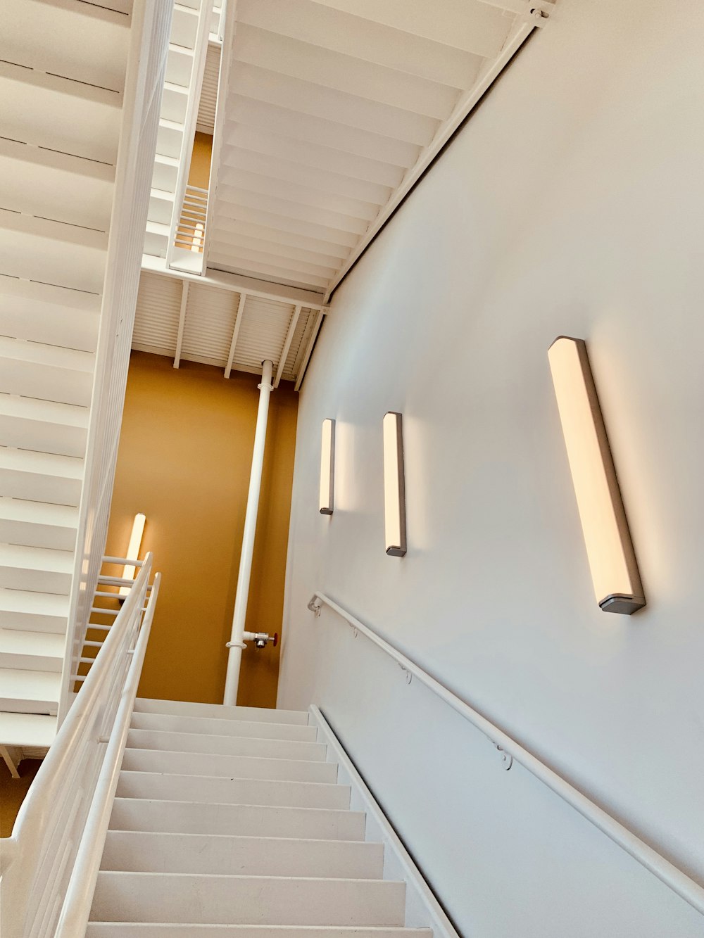 white painted wall and stairs close-up photography