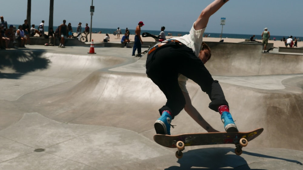 photography of man playing skateboard during daytime