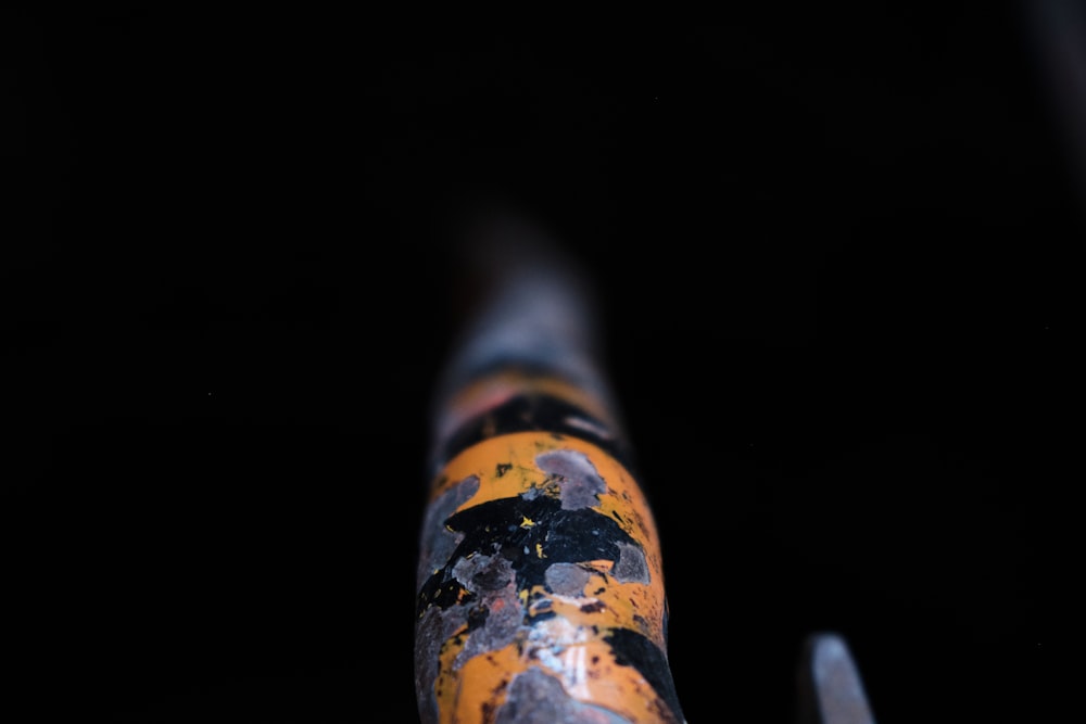 a close up of a metal object in the dark