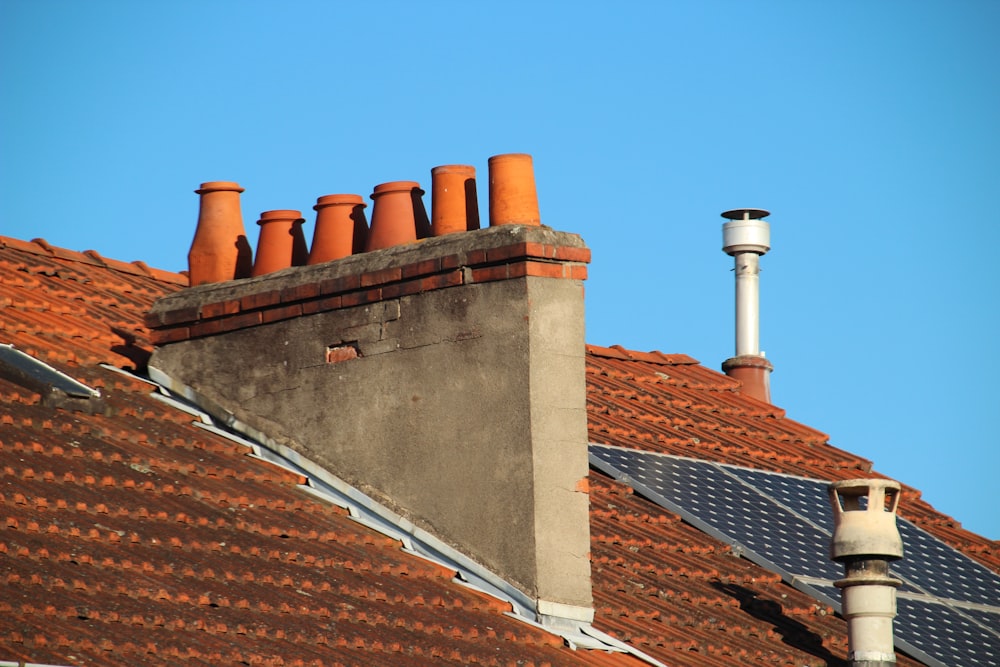 brown and white chimneys on roof