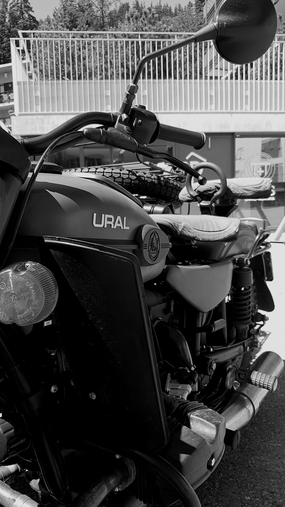 grayscale photo of Ural empty motorcycle