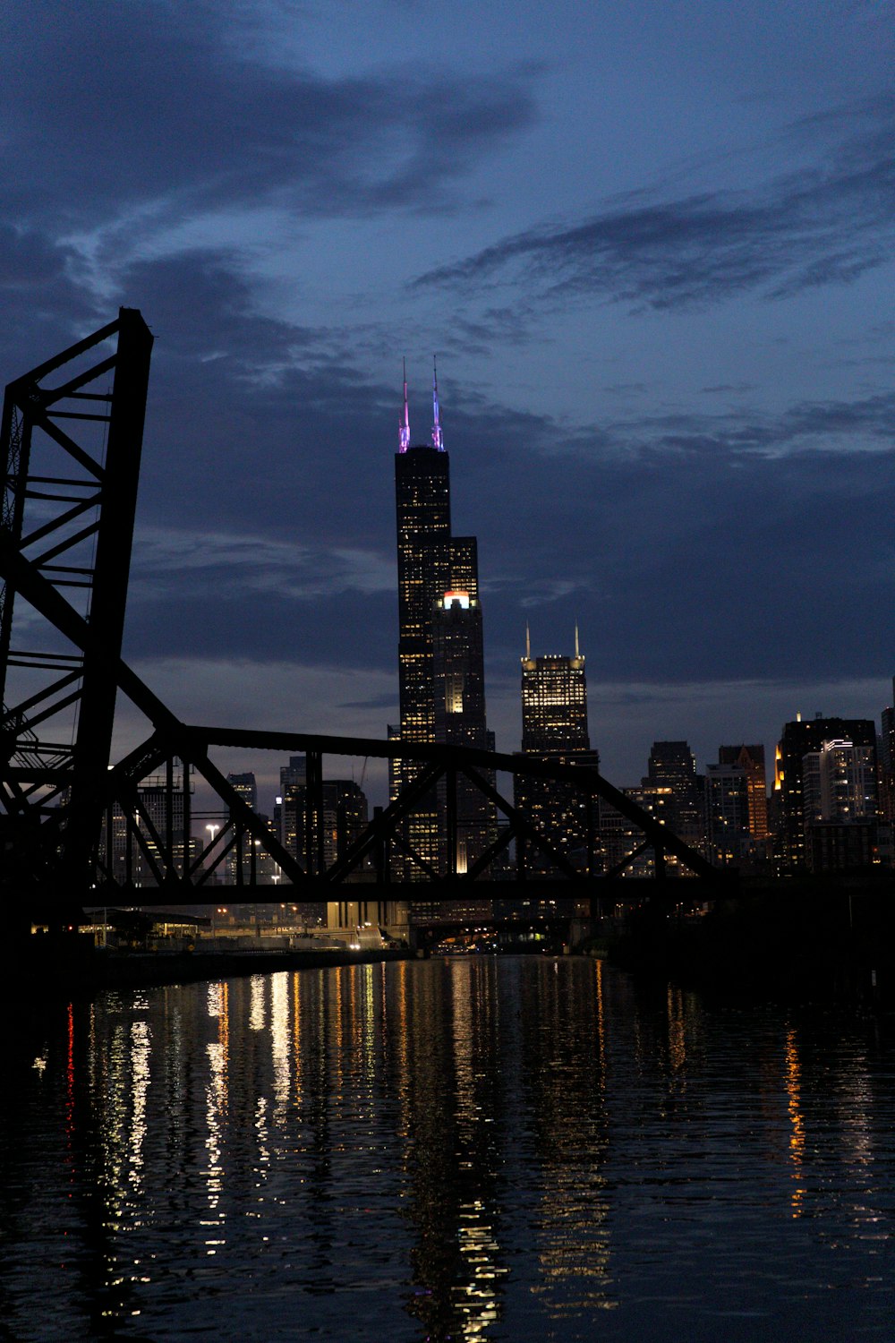 silhouette of bridge near buildings