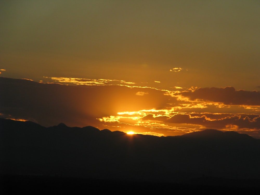 silhouette of mountain during golden hour