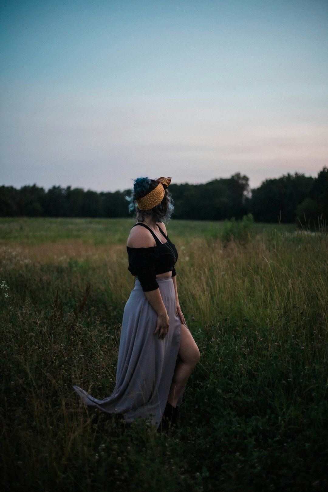 women standing in a green grass field during daytime