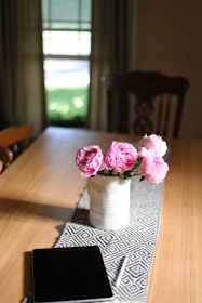Close-up of a vibrant patterned table runner contrasting beautifully with a sleek marble tabletop.