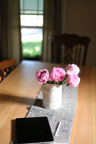 Elegant crochet table runner displayed on a minimalist wooden table with natural light.