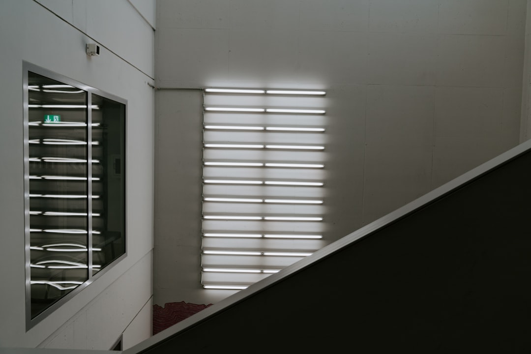 white painted wall inside well lit room