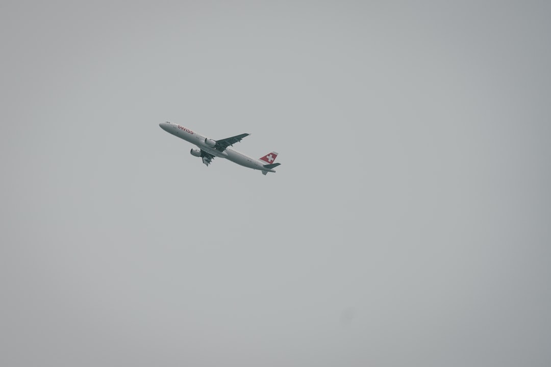 flying white plane,