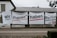 Large banners with bold text hang on the exterior wall of a building. The text is in German and translates to 'We women have rights!'. Several hashtags and the name 'UNIA' are visible on the right banner.