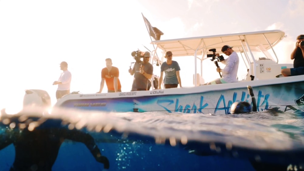 people filming on boat