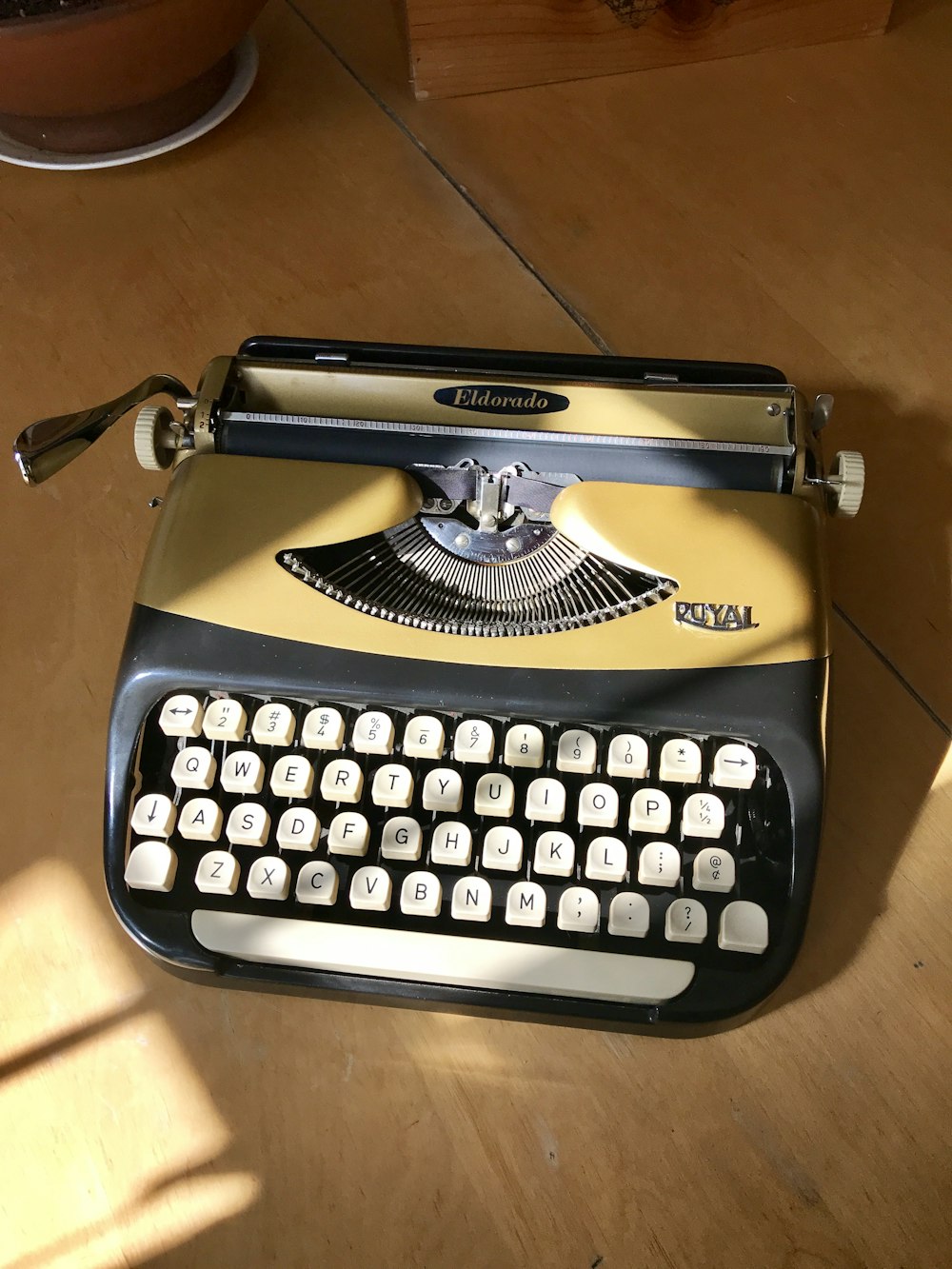 brown and black Royal typewriter