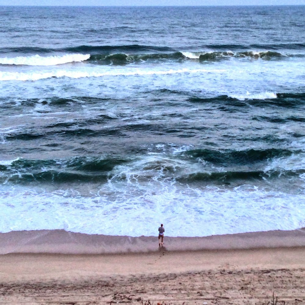 man standing seashore