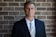 portrait photography of man wearing black suit jacket