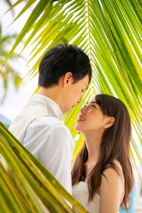 A couple sharing a tender moment framed by lush greenery at the Pench Tiger Reserve.