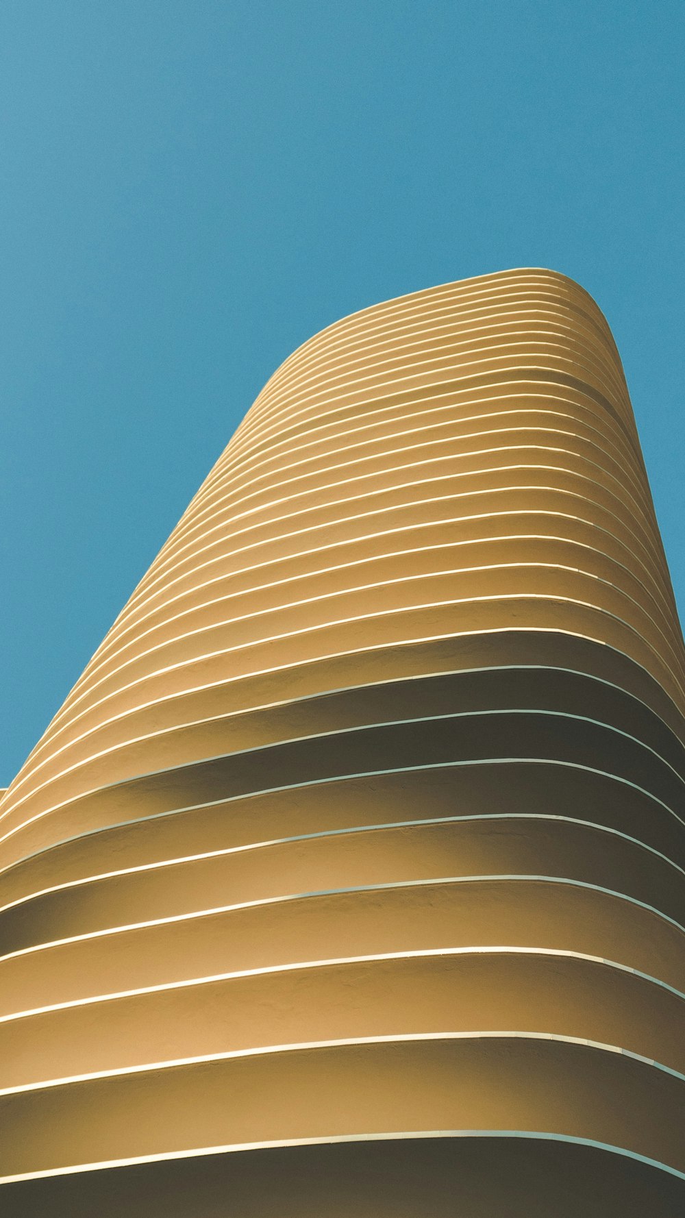 beige concrete building under blue sky