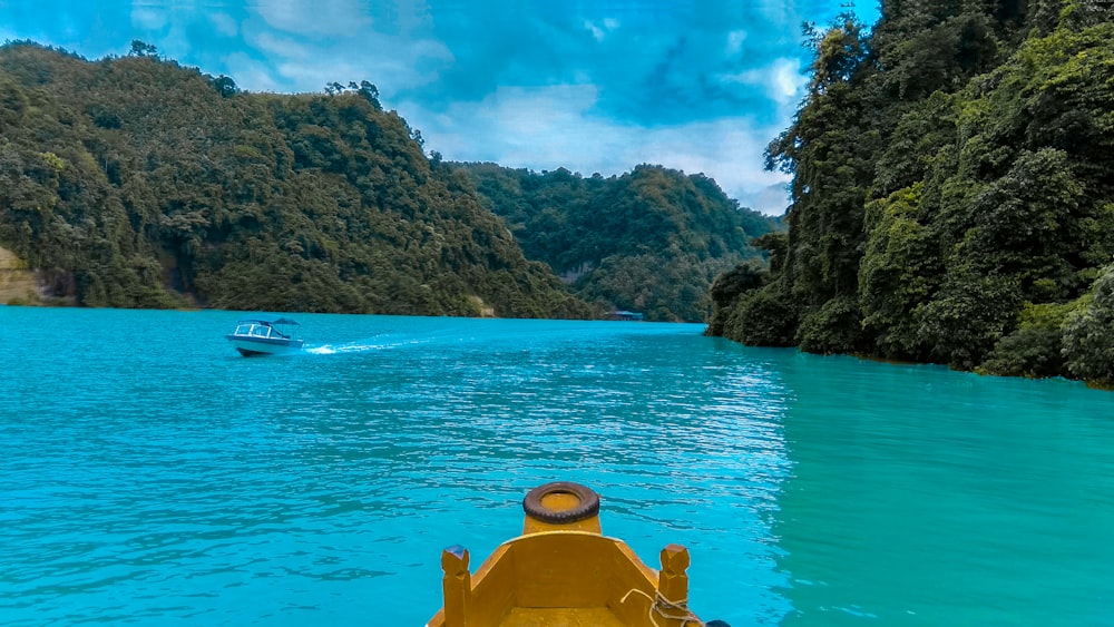 boats on body of water near islands