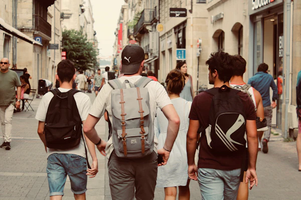 A group walking down a busy shopping street