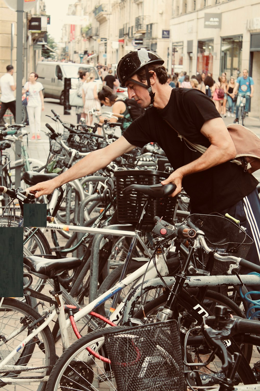 man holding black and gray bicycle close-up photography