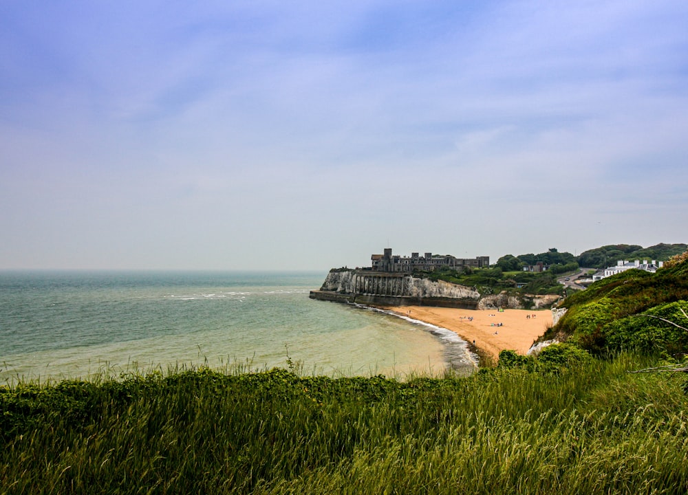 concrete buildings near body of water