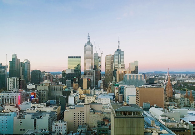 A panoramic view of a city skyline featuring new real estate projects.