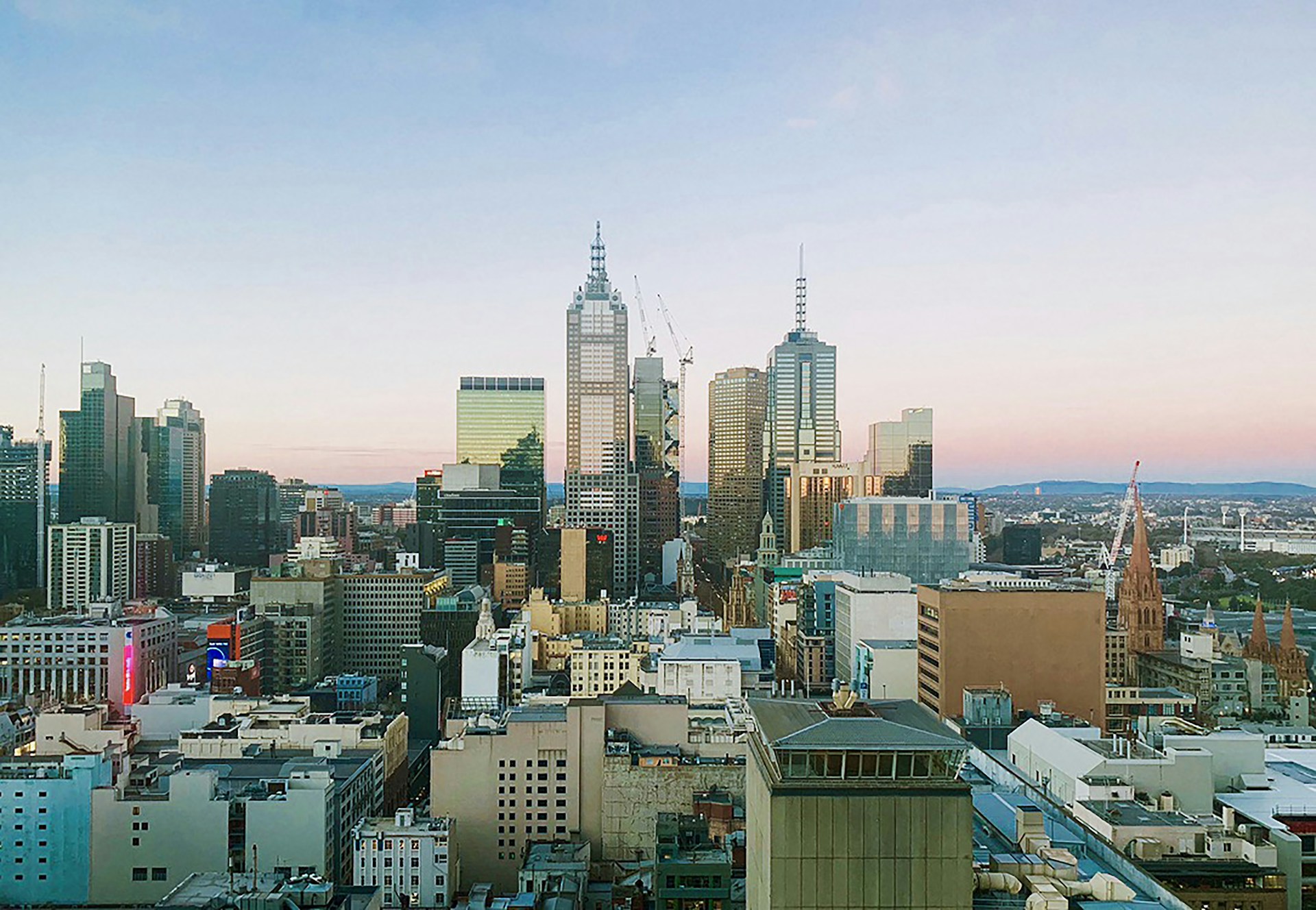 woman wearing yellow long-sleeved dress under white clouds and blue sky during daytime