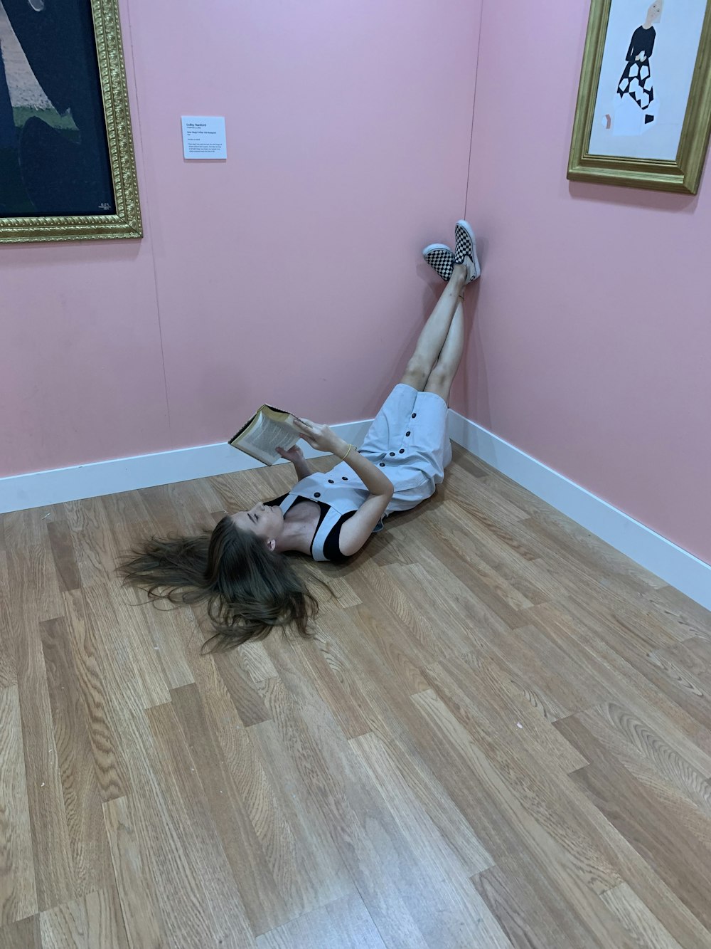 women lying in a brown floor in a room