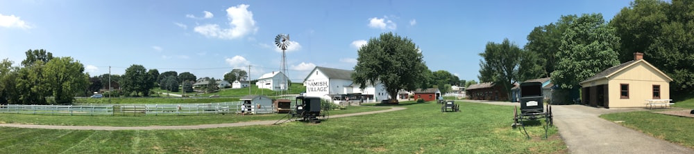 green tractor near beige house