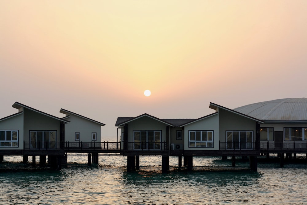 white sheds over the sea water