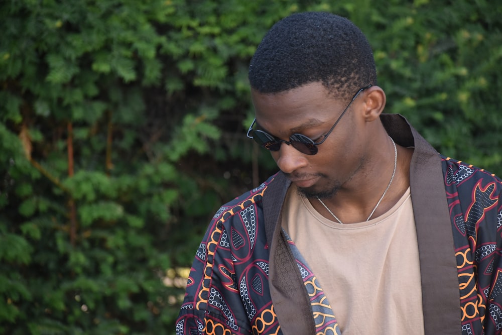 man wearing brown shirt and sunglasses