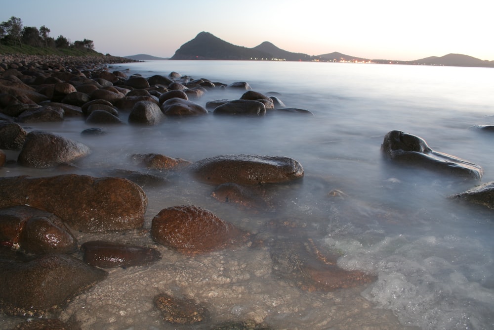 a body of water with rocks in it