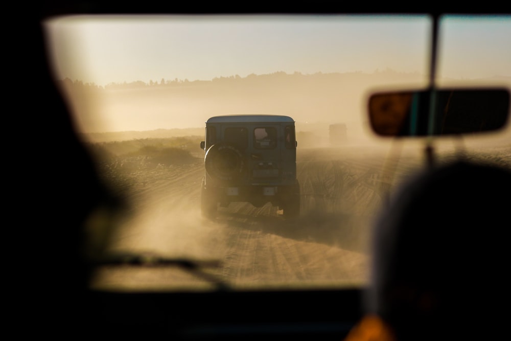 blue SUV on road